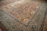 Antique Sultanabad carpet corner detailing rare dusty emerald green border and pale rust field with floral palmettes.