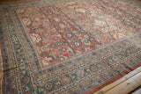 Antique Sultanabad carpet's intricate field of floral palmettes, with a rare dusty emerald green border.