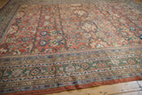 Antique Sultanabad carpet border detail featuring dusty emerald green, floral palmettes, and vinery.