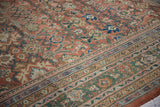 Antique Sultanabad carpet's pale rust floral field and rare dusty emerald green border.
