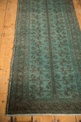 Vintage overdyed Belouch runner detail: dusty aqua blue and charcoal tree of life pattern.