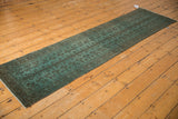 Vintage overdyed Belouch runner detail showing faded aqua tree-of-life design.