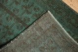 Vintage Belouch runner's dusty aqua pile, dark pattern, and hand-knotted foundation.