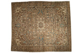 Distressed vintage Persian Karaja carpet with geometric medallion, blue accents, and brown abrash.