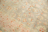 Distressed vintage Sivas carpet, blush pink border, oxidized silver field, and cinnabar floral vinery.