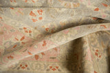 Vintage Sivas carpet detail: low pile reveals foundation, with blush pink and cinnabar florals.