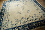 Antique Peking carpet corner, ivory field with cobalt butterfly, blossomed roses, and vinery.