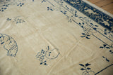 Close-up of antique Peking carpet, creamy ivory field with delicate indigo floral vinery.