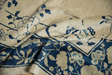 Antique Peking rug corner with delicate cobalt blue vinery and ivory blossomed roses.