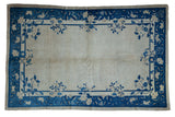 Vintage Chinese Peking rug, ivory field, cobalt blue border with sprawling vines and roses, 5x7.5.