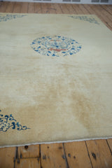 View across the hand-knotted surface showing the short, even pile of an antique Chinese Peking carpet.
