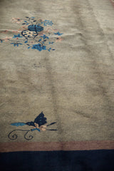 Intricate blue butterfly, delicate vinery, and blossoms on an oxidized silver vintage Peking carpet.