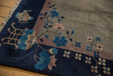 Vintage Peking Carpet corner with dusty mauve border, blue floral vinery, and teapot motif.