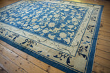 Antique Peking carpet border with cobalt blue cloudband and rhinoceros horn motifs on beige.