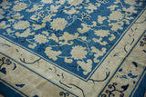 Corner of antique Peking carpet showcasing elaborate vinery, ivory blossoms, and a cloudband border.