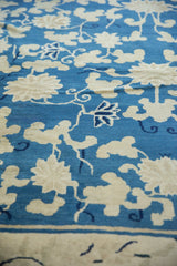 Sky blue antique Peking carpet with ivory blossoming vinery, lotus flowers, and cobalt accents.