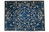 Antique Peking carpet with allover ivory butterflies, palmettes, and vinery on cobalt blue.