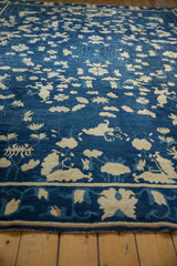 Indigo blue field detail of antique Peking carpet with ivory butterfly and palmette motifs.