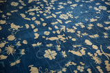 Intricate ivory floral and butterfly patterns with subtle abrashes on the deep indigo Peking carpet.