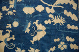 Antique Peking carpet's deep blue hand-knotted pile, with ivory floral vinery patterns.