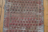 Distressed Malayer rug detail with repeating blush botehs, worn pile, and visible foundation.