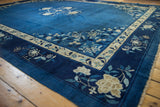 Vintage Peking carpet corner with ivory floral border, dense blossoms, and original side selvage.