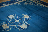 Hand-knotted ivory and powder blue blossoms of the central motif on a vintage Peking carpet.