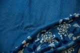 Fine hand knotted pile showcasing dense floral motifs in cobalt, silver, and ivory.