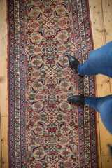 Antique Bijar runner shown at full length to demonstrate scale with its intricate allover design.