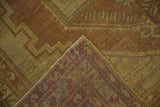 Distressed Oushak rug corner revealing worn gold pile, woven red foundation, and side cord selvage.
