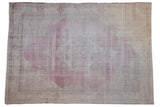 Vintage distressed hand knotted Sparta carpet, raspberry floral medallion, ivory field.