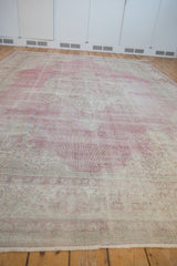 Vintage Distressed Sparta carpet, showing faded raspberry red and ivory, with worn texture.
