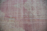 Reverse of hand-knotted Sparta rug, showing faded raspberry and ivory foundation weave.