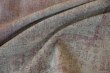 Distressed Sparta rug texture close-up, revealing wear to foundation and knot heads.