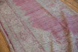 Distressed vintage Sparta carpet, showcasing worn pile texture in raspberry red and ivory.