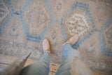 Distressed Serab runner with hexagonal medallions in abrashed powder blue and sand.