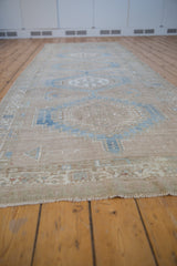 Distressed Serab runner showcasing elongated hexagonal medallions and soft blue abrashed tones.