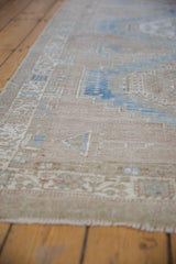 Abrashed sandy pile of the distressed vintage Serab runner, with faint powder blue geometric motifs.