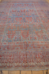 Antique Distressed Belouch carpet detail, geometric plants, vase relief, terracotta and powder blue.