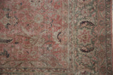 Distressed floral motifs and border details in dusty blush, silver, and green.