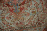 Vintage Distressed Heriz carpet pile with worn brick red, denim blue, and visible foundation.