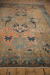 Distressed vintage Karaja carpet with patina of muted brick red, navy, and sky blue patterns.