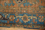 Distressed Karaja rug border detail: geometric turtle design in sky blue and dusty brick red.
