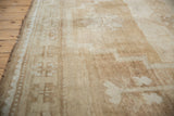 Abrashed ivory and pale coffee brown tones with short pile texture.