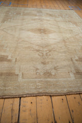 Stepped corner spandrel with tree of life motif on vintage distressed Kars rug.