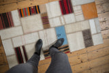 Vintage Turkish patchwork flatweave runner with paneled ivory, tangerine, and faded red kilim fragments.
