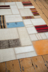 Distinct seamed panels in ivory, blue, red, and orange on vintage Turkish patchwork runner.