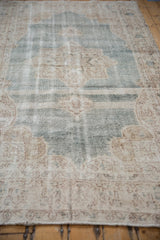 Distressed texture with time-softened abrashed pale denim blue and ivory tones.