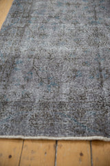 Distressed vintage Sparta rug texture, revealing wear to knot heads and foundation.