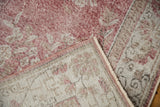 Faded rose blush pile and tightly woven light foundation on a folded Sparta rug.